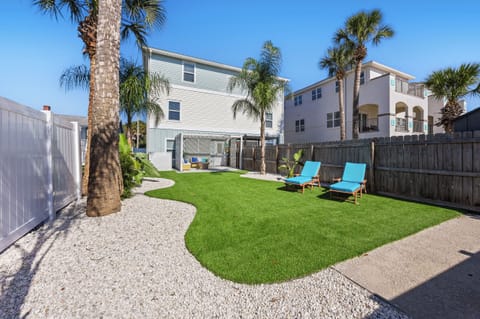 Private backyard with lounge chairs and plenty of space to relax