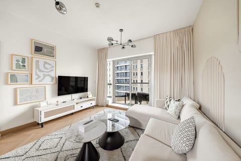 Living Room: Stylish space with designer decor and stunning city views—perfect for relaxation!