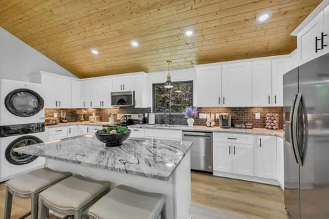Full kitchen equipped with stainless steel appliances