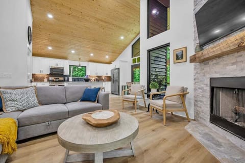 Open concept living area with stylish furnishings