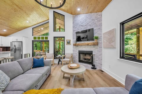 Open concept living area with stylish furnishings