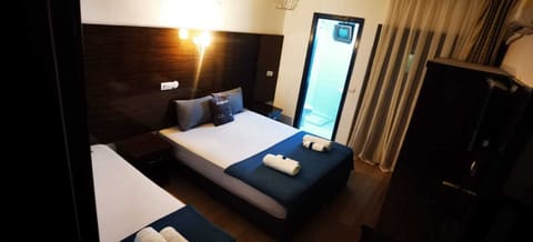 Standard Double Room, Balcony, Garden View | Laptop workspace, free WiFi