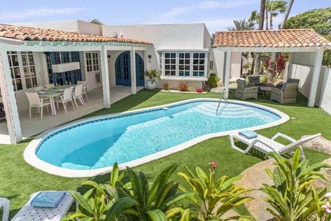 The spacious garden at Hidden Jewel is a lush and private retreat, with plenty of room to relax, play, and enjoy the Aruban sunshine.
