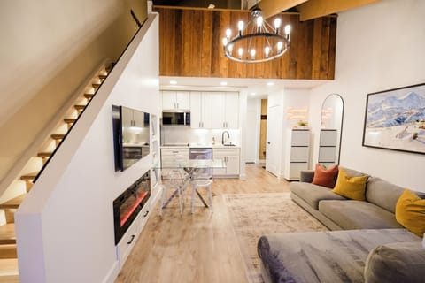 Bright, open living space with vaulted wood ceilings, a cozy and comfortable mix