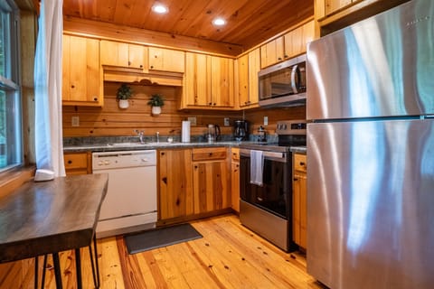 Whip up your favorite dishes in our well-stocked kitchen featuring everything you need for home-cooked meals.