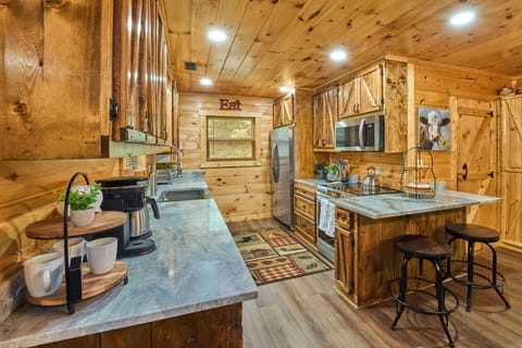 Rustic Cabin Kitchen | Wood Cabinets, Stone Countertops & Stainless Steel Appliances