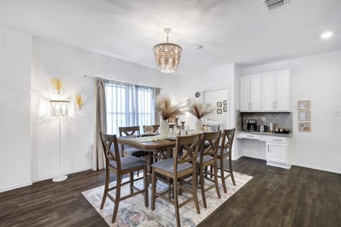 Spacious dining table that sits 8 with full tableware and silverware included.