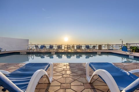 Soak in sunrise serenity from the sparkling oceanfront pool deck.