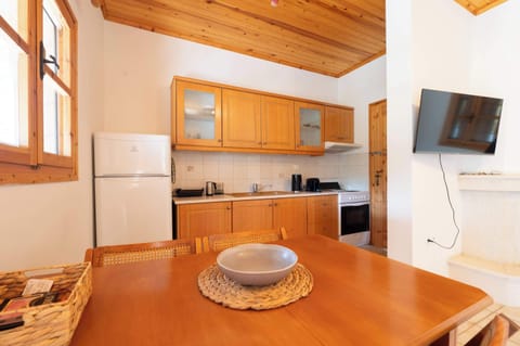 Kitchen and dining space with wood accents