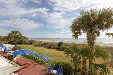 Take in wide ocean views from the resort’s sun deck just steps from the sand.