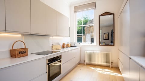 The kitchen is spacious and has an oven and hob, kettle, toaster and coffee machine.