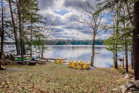 Spacious waterfront setting with firepit, kayaks, and Muskoka chairs waiting for you