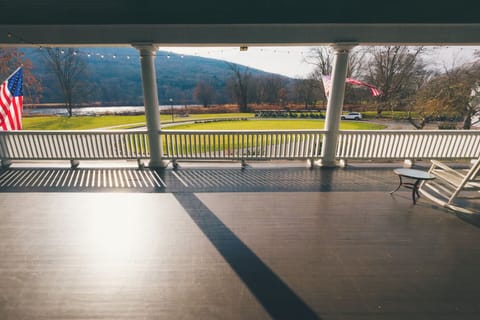 Sip coffee on the wide porch overlooking peaceful mountain views.