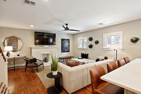 | Living Room Unit C | Lounge Area with Ceiling Fan and Natural Light | Unit C — Carriage House First Floor