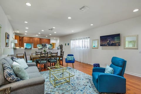 Spacious ADU living room with plenty of seating, a sofa sleeper, dining area for six, and Smart TV for entertainment.