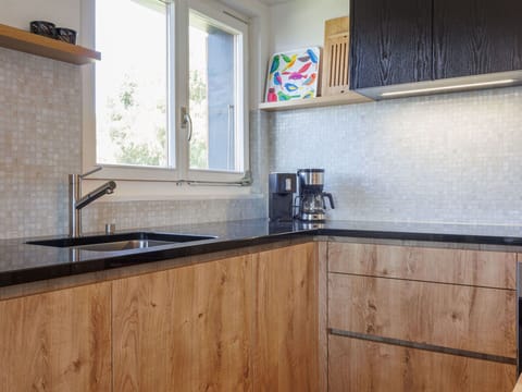 Wood, Countertop, Flooring, Kitchen, Cabinetry, Kitchen Sink, Interior Design, Plumbing Fixture, Wood Stain, Hardwood