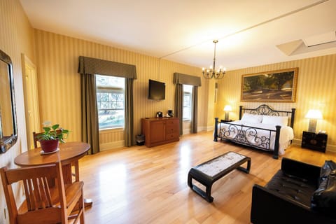 Unwind in a spacious bedroom with soft lighting and charm.