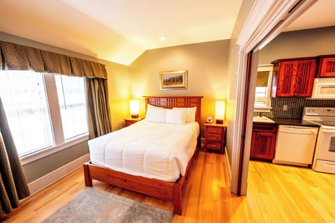 Unwind in a sunlit king bed with peaceful hotel comfort.