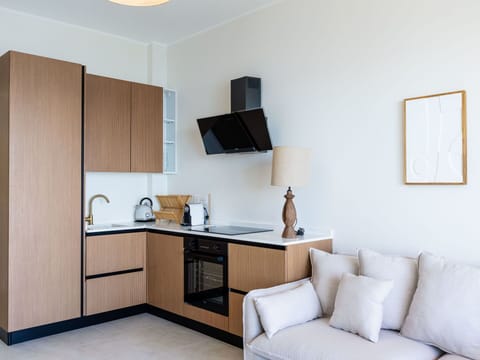 Furniture, Interior Design, Wood, Flooring, Floor, Room, Cabinetry, Lighting, Countertop, Kitchen