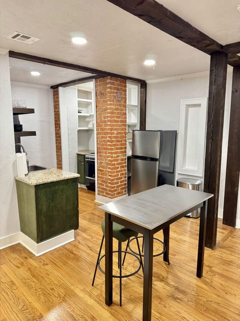 Full kitchen includes all the amenities and a dining table for two.
