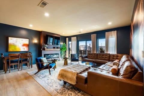 Indulge in luxury living with this spacious and stylish living room, featuring a sleeper sofa, a beautiful view, and a dining area.