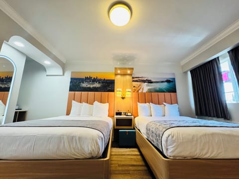 Deluxe 2 Double Beds | Bathroom | Free toiletries, hair dryer, towels, soap