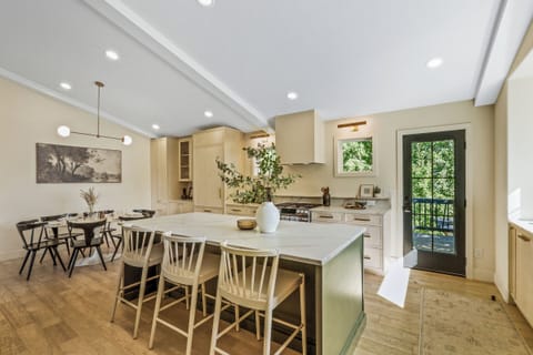 Gather around the kitchen island—great for snacks, wine, or family chats