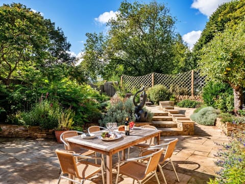 Furniture, Outdoor Furniture, Garden, Shrub, Chair, Outdoor Table, Table, Flagstone, Flowerpot
