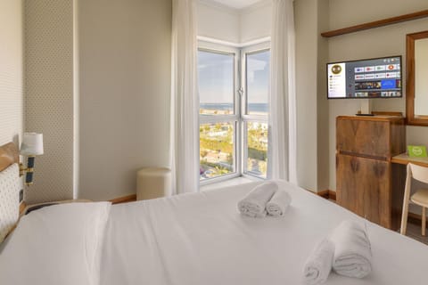 Standard Quadruple Room, Non Smoking, Beach View | Minibar, in-room safe, desk, blackout drapes
