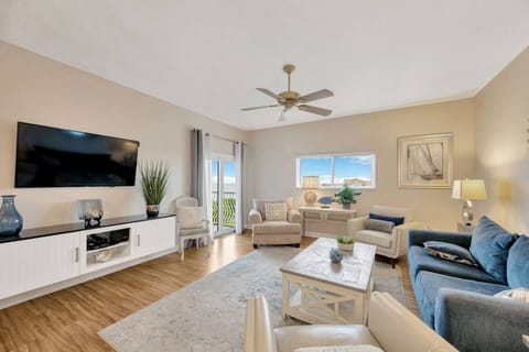 Spacious open Living room with sliding glass doors to the balcony.