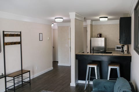 Suite, 1 King Bed | Private kitchenette | Full-size fridge, microwave, cookware/dishes/utensils, freezer