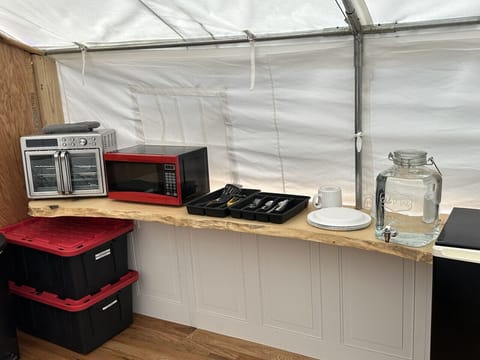 Kitchenette: toaster oven, microwave, utensils, water jug, & mini fridge