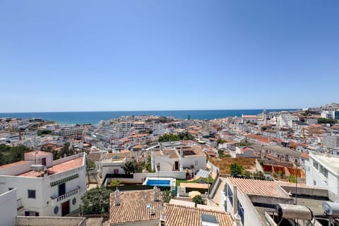 Dine with panoramic sea and old town views