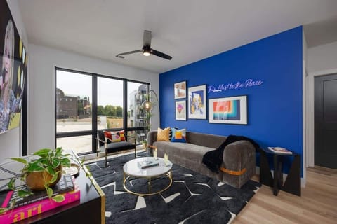 Unit 2: Open concept living area with floor to ceiling windows! Features designer furniture and smart TV!
