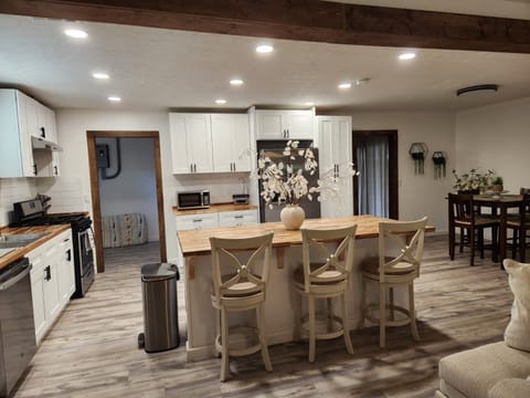 Modern kitchen with island seating and stainless appliances