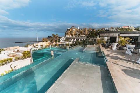 2 outdoor pools, open 10:00 AM to 6:00 PM, pool umbrellas, sun loungers
