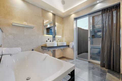 Designer toiletries, hair dryer, towels, soap