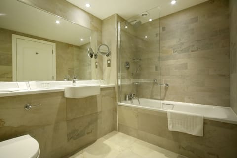 Designer toiletries, hair dryer, towels