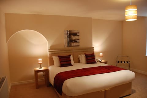 Premium bedding, desk, laptop workspace, soundproofing