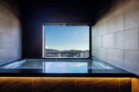 Premium Suite | Bathroom | Separate tub and shower, deep soaking tub, free toiletries, hair dryer