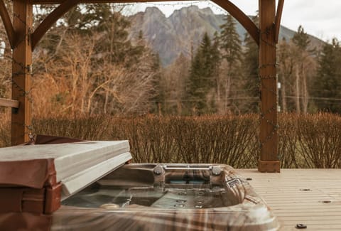 Enjoy a soak in the hot tub with a beautiful view of Mt. Si!