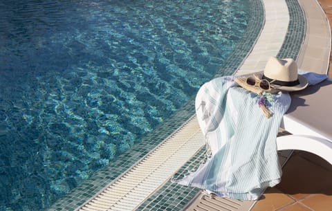 2 outdoor pools, a waterfall pool, pool umbrellas, sun loungers
