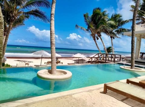 Private beach, white sand, free beach cabanas, sun loungers