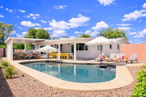 Private pool oasis with loungers, umbrellas & covered alfresco dining