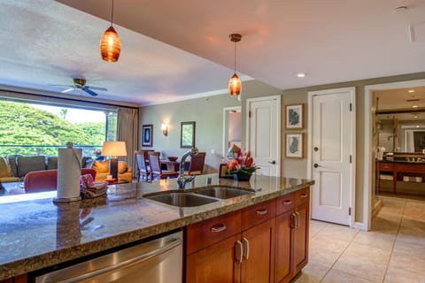 Modern kitchen island with open layout to living and dining areas. HKK-242