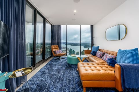 Relax in contemporary comfort, surrounded by vibrant textures in a spacious stylish living room.