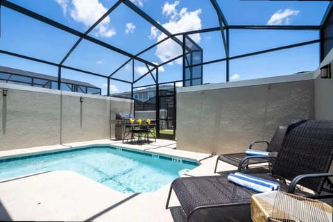 Enjoy your private screened pool and patio, complete with comfy loungers and an outdoor dining area-perfect for sunny relaxation and al fresco meals!
