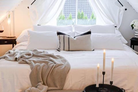 This is our master bedroom with a king sized bed, luxurious bedding of 100 % bamboo or organic cotton bedsheets for a very soft and luxurious feel. Your sleep quality can be greatly improved by quality bedding that has temperature control fabrics. 