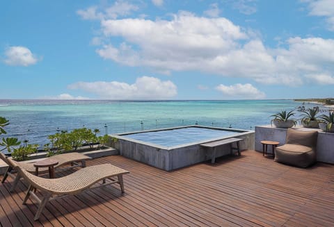 Exclusive private rooftop with sunbeds and stunning beach views — the perfect spot to relax and unwind.