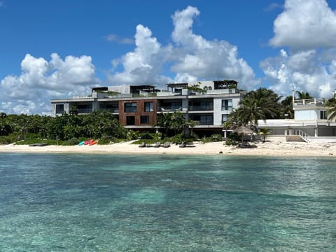 Drone view of the Antal complex with the ocean stretching out in front of it
